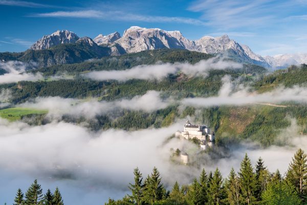 Hohenwerfen Castle in Austria. Foggy morning in Autumnal Season Hohenwerfen Castle in Austria. Foggy morning in Autumnal Season
